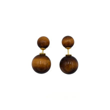 Double-sided brown tiger eye stone stud earrings with gold-tone posts on white background