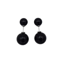 Pair of black double ball stud earrings with silver posts on white background