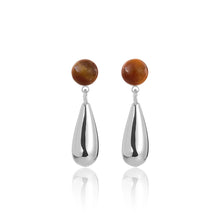 silver teardrop earrings with round brown amber stone studs on white background