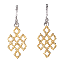 Intricate gold and silver dangle earrings with textured geometric diamond shapes