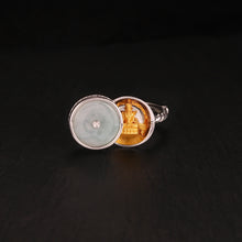Silver ring with jade cover featuring a gold Medicine Buddha statue inside on black background