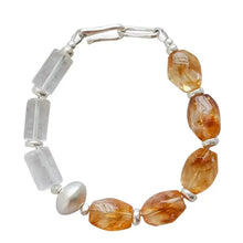 Bracelet with translucent orange and clear rectangular beads and silver-toned spacer beads