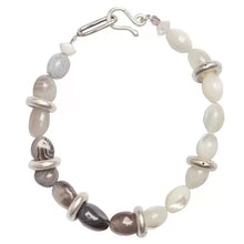Silver and white beaded bracelet with mixed smooth and ring-shaped beads and hook clasp