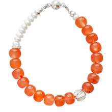 Elegant bracelet with translucent orange beads, freshwater pearls, and silver clasp